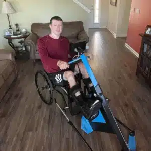 Terry's image on the Myolyn FES bike in a testimonial about better sleep patterns, pain management, and reduced spasticity
